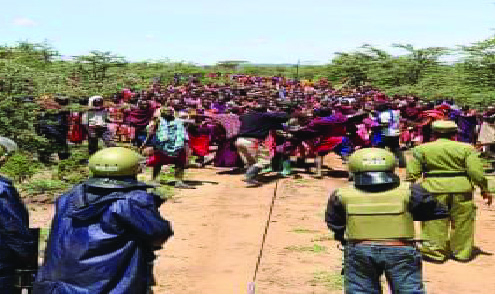 Groups of people a five police in olive gree n helmets